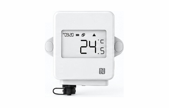A wireless temperature and humidity sensor with a digital display reading 24.5 degrees.
